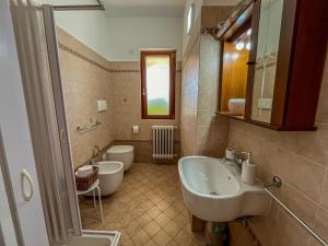 a bathroom with a sink and a toilet at Country Home in Crispiano