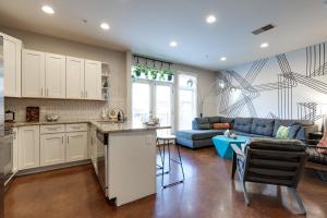 a kitchen and living room with a blue couch at Pet Friendly Stylish Funky Central & Free Parking in Nashville
