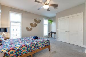 a bedroom with a bed and a ceiling fan at Pet Friendly Stylish Funky Central & Free Parking in Nashville