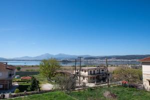 a view of a town with a lake in the background at Lake House Ioannina in Ioannina
