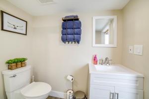 a bathroom with a white toilet and a sink at Pocatello Vacation Rental with Mountain Views! in Pocatello +21 photos