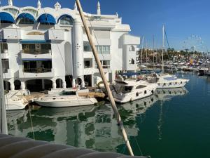 a group of boats are docked in a marina at Piso islas C111 in Benalmádena