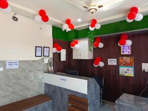 a room with red and white balloons on the wall at Shri Girraj Residency in Mathura