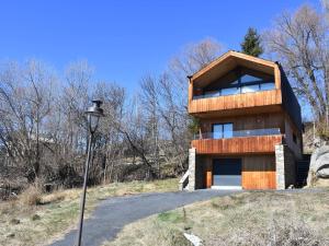 a house on top of a hill with a street light at Chalet individuel plein sud avec suites parentales, garage et équipements modernes – 8 pers. max - FR-1-580-111 in Font Romeu Odeillo Via