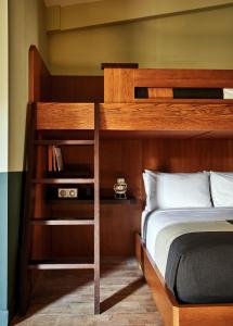a bedroom with a bunk bed with a book shelf at The Outpost Rocky Mountains in Estes Park