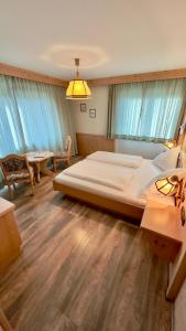 Voodi või voodid majutusasutuse Hotel Alpenrose toas