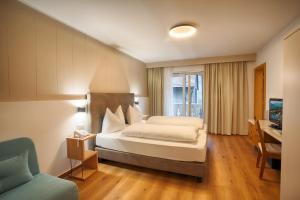 Postel nebo postele na pokoji v ubytování Hotel Lamm + 37 fotografií