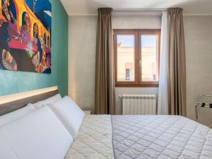 Posteľ alebo postele v izbe v ubytovaní Azzurra Apartments