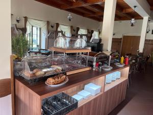 a kitchen with a counter with food on it at Pension Hubert in Raspenava