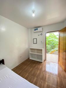 Ein Bett oder Betten in einem Zimmer der Unterkunft Road 69 Siargao