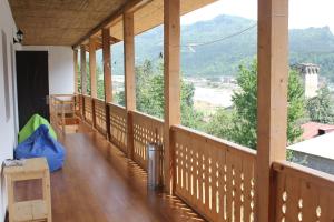 a balcony with a view of the mountains at Svan House In Mestia in Mestia