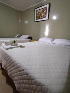 Cama o camas de una habitación en Intihuatana hospedaje restaurant campestre.