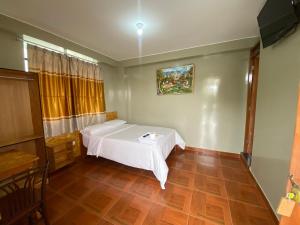 Cama o camas de una habitación en Intihuatana hospedaje restaurant campestre.