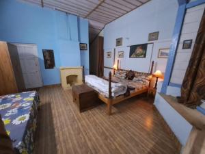 Voodi või voodid majutusasutuse Leela Cottages toas