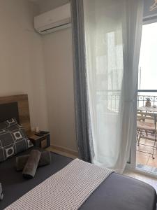 Łóżko lub łóżka w pokoju w obiekcie Meli Μaisonette