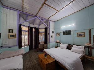 Voodi või voodid majutusasutuse Leela Cottages toas