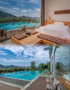 a bedroom with a view of a swimming pool at Avatar Mountain Resort in Zhangjiajie