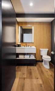 a bathroom with a sink and a toilet at The Watershed - Formerly Hotel Zero Degrees in Norwalk