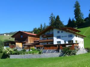 a view of the hotel from the hill at Alpenfarm Poschhof in Kaunerberg