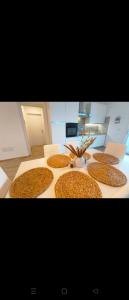 a table topped with four cookies on top of it at House La Torricella in Vetriolo