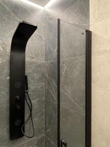 a shower with a glass door in a bathroom at Plaza Mayor de Salamanca By LixLoft in Salamanca