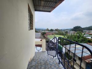 a balcony of a building with a view at Hostal Carolinas in Juayúa