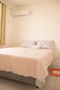 En eller flere senge i et værelse på Casa com lazer completo e WiFi em Aquiraz CE