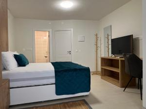 Ένα ή περισσότερα κρεβάτια σε δωμάτιο στο Casa Pozzetto