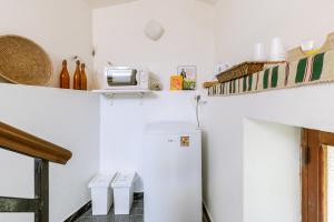 Kuchyň nebo kuchyňský kout v ubytování Giaminera Rooms & Art Studio