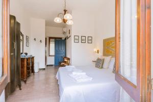 Postel nebo postele na pokoji v ubytování Giaminera Rooms & Art Studio