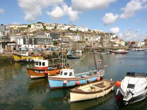 a group of boats are docked in a harbor at The Old Sweet Shop in Par