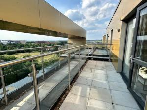 an empty balcony of a building with a view at Chic 1 Bed MCR Ap w/Balcony- Sleeps 4 in Manchester