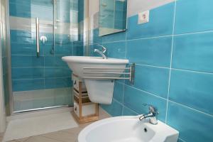 Koupelna v ubytování Dòmo#31 - Villa con Piscina, Giardino e Parcheggio + 16 fotografií