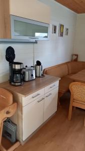 a kitchen with a counter with pots and pans on it at Landhaus Westrich in Walldürn