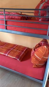 a bunk bed with two pillows on the bottom shelf at Landhaus Westrich in Walldürn