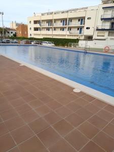 Piscina de la sau aproape de Atalaya Apartment by Hello Homes Sitges