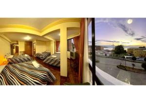 two beds in a room with a view of a city at HOTEL WENDY MAR in Copacabana