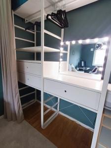 a bedroom with a bunk bed with a desk and a mirror at Modern, private spacious & fully equipped for 2-6 people Near forest, with kitchen, washer, pets friendly in Floda