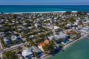 an aerial view of a resort next to the ocean at Dolphins Run home in Anna Maria