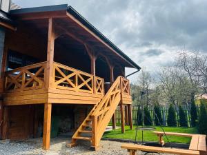 a large wooden building with avisedvisedvisedvisedvisedvisedvisedvisedvisedvised at Domek RajskiRaj in Rajcza