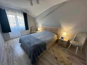 Postel nebo postele na pokoji v ubytování Ștefan House 1