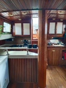 a kitchen with wooden cabinets and a counter top at Mondragón in Puerto de Mogán