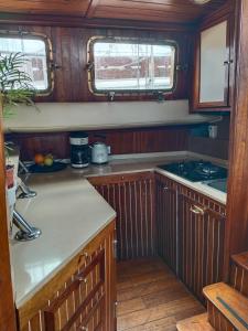 a kitchen with wooden cabinets and a counter top at Mondragón in Puerto de Mogán