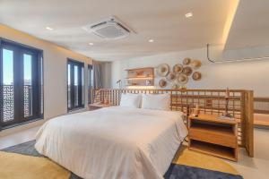 Кровать или кровати в номере Gorges Residence Salvador