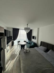 a bedroom with a bed and a living room at Notherland Premier Famagusta in Famagusta
