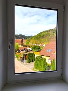a window with a view of a town at Rentcenter79 in Sankt Peter-Freienstein