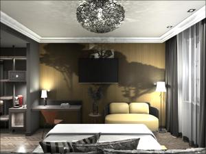 a bedroom with a bed and a chandelier at Hotel Fürstenhof Boutique Leipzig in Leipzig