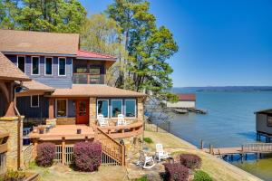 a house with a view of the water at Luxurious Lakefront Paradise in Scottsboro with Dock in Scottsboro