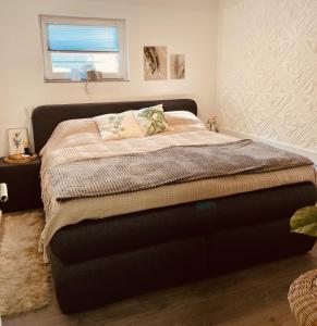 Ένα ή περισσότερα κρεβάτια σε δωμάτιο στο Wellness-mit-Stil