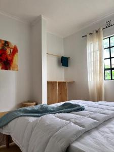 Кровать или кровати в номере Meru Villas